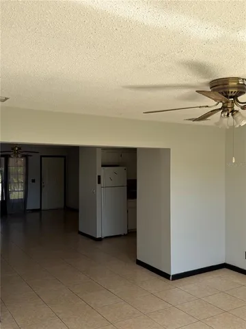 a view of a refrigerator and window in a room