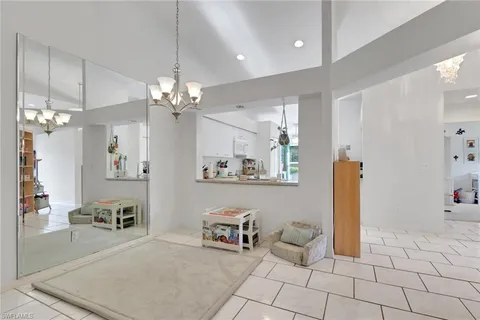 a spacious bathroom with a double vanity sink and a mirror