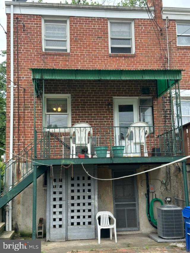 1619 Inverness Avenue Baltimore, MD 21230 - Photo 27 of 30 a front view of a house with large windows
