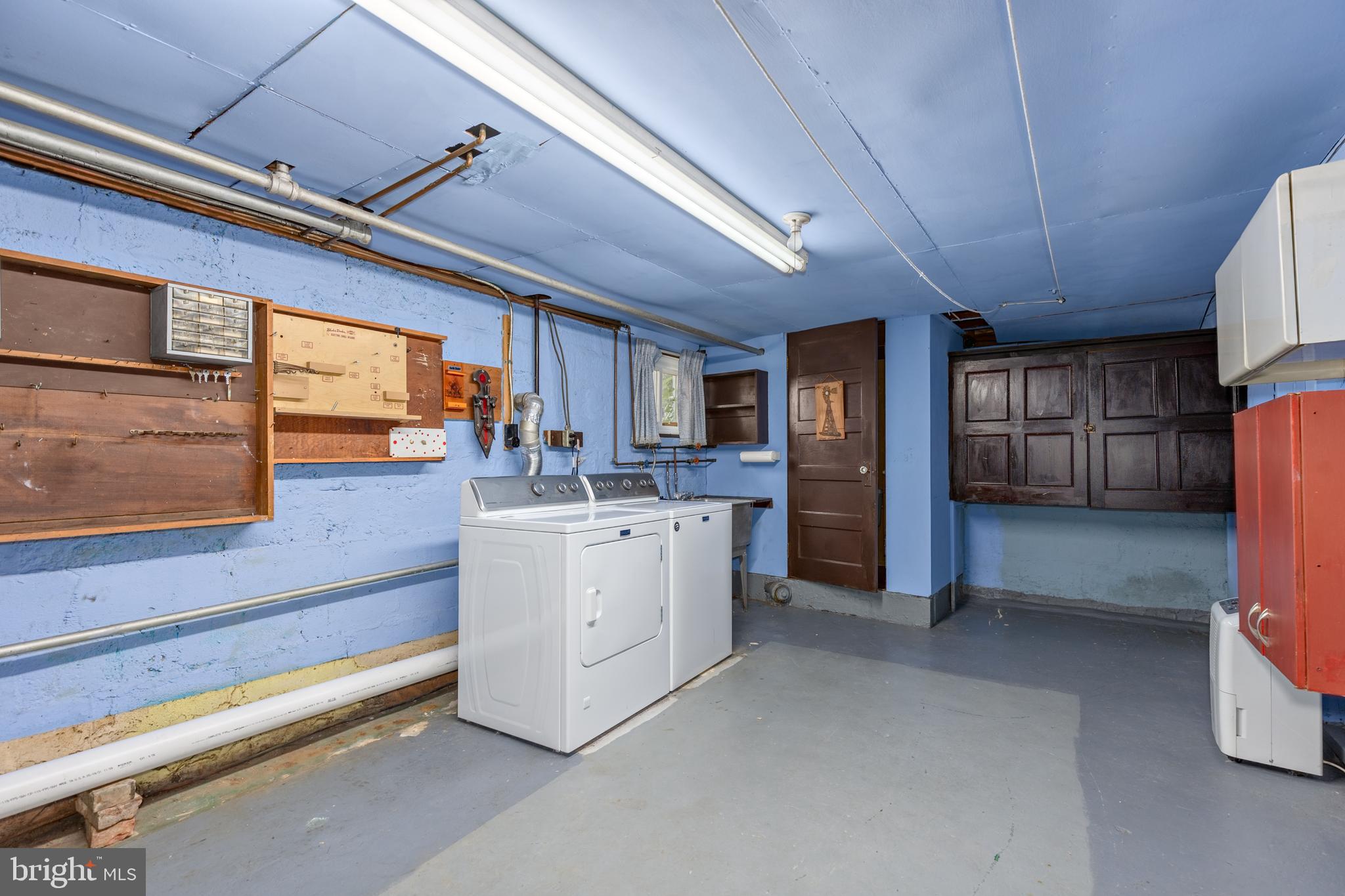 6426 Sherwood Road Baltimore, MD 21239 - Photo 29 of 43 a room with storage and utility