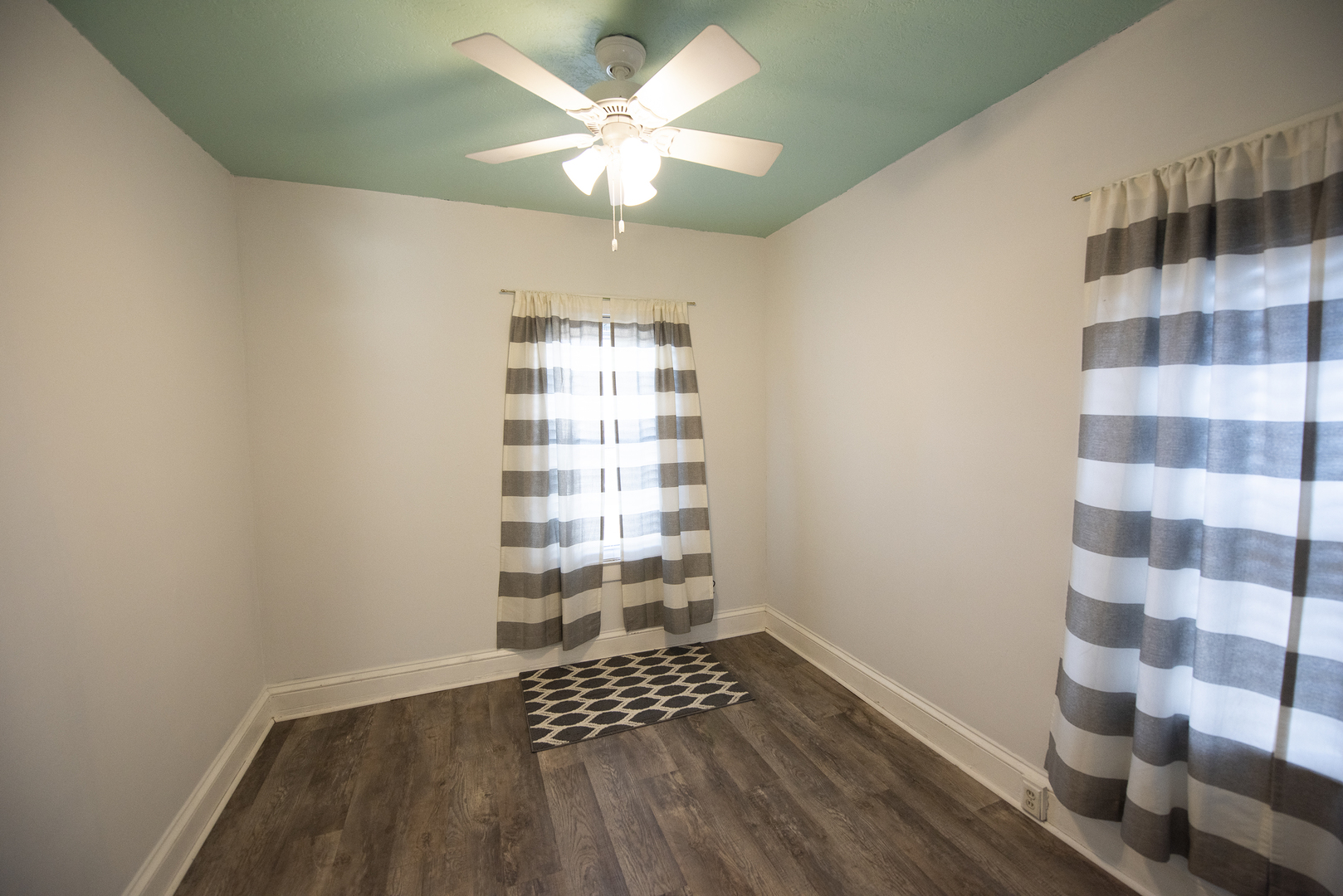 716 Locust Street Sterling, IL 61081 - Photo 19 of 27 a view of wooden floor and windows in a room