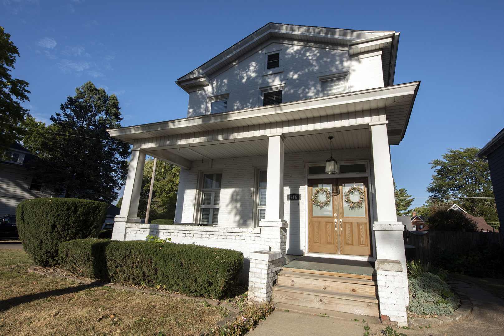 716 Locust Street Sterling, IL 61081 - Photo 2 of 27 front view of a house with a small yard