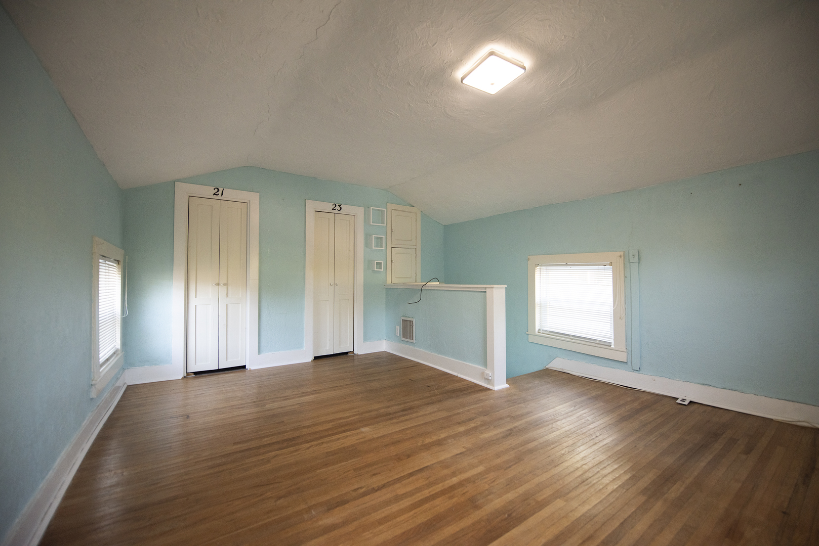 716 Locust Street Sterling, IL 61081 - Photo 23 of 27 a view of empty room with wooden floor and fan