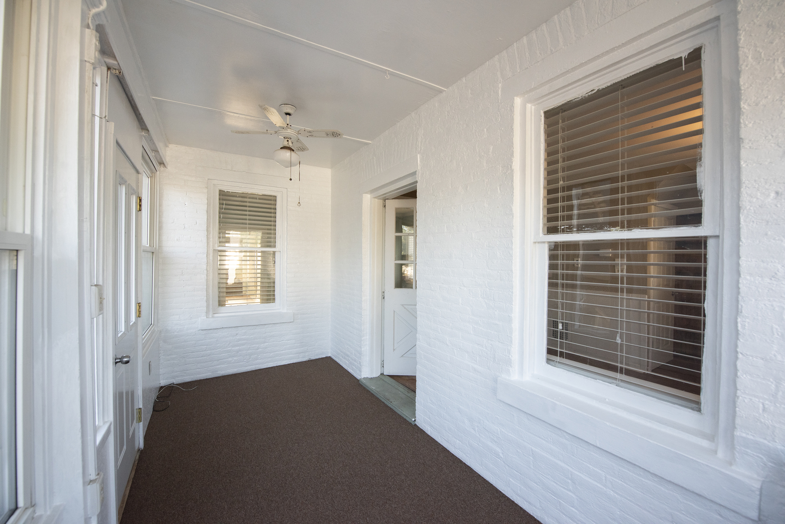 716 Locust Street Sterling, IL 61081 - Photo 24 of 27 a view of bedroom with a ceiling fan and window
