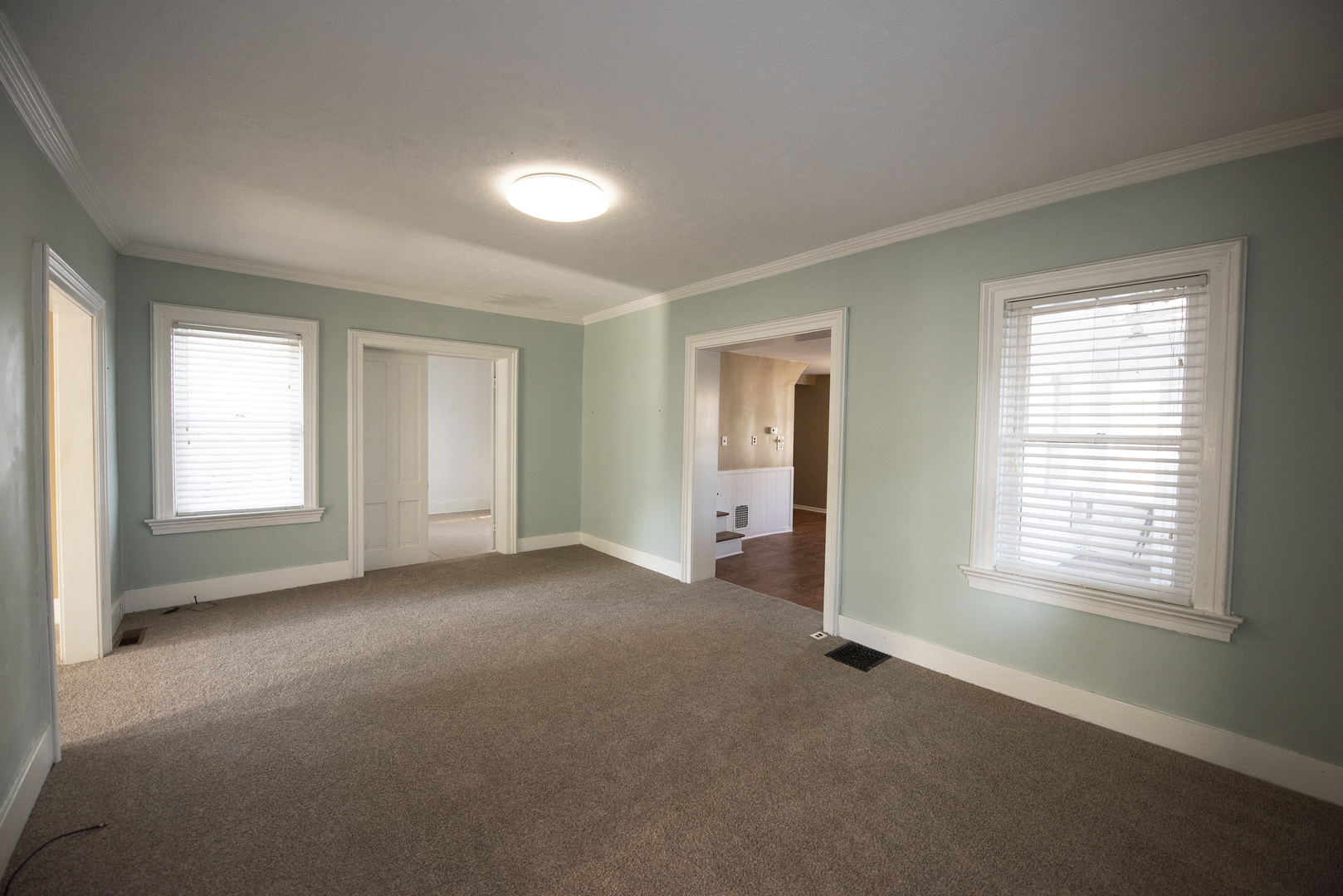 716 Locust Street Sterling, IL 61081 - Photo 10 of 27 an empty room with windows