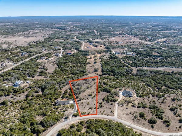 a view of a lake with a yard