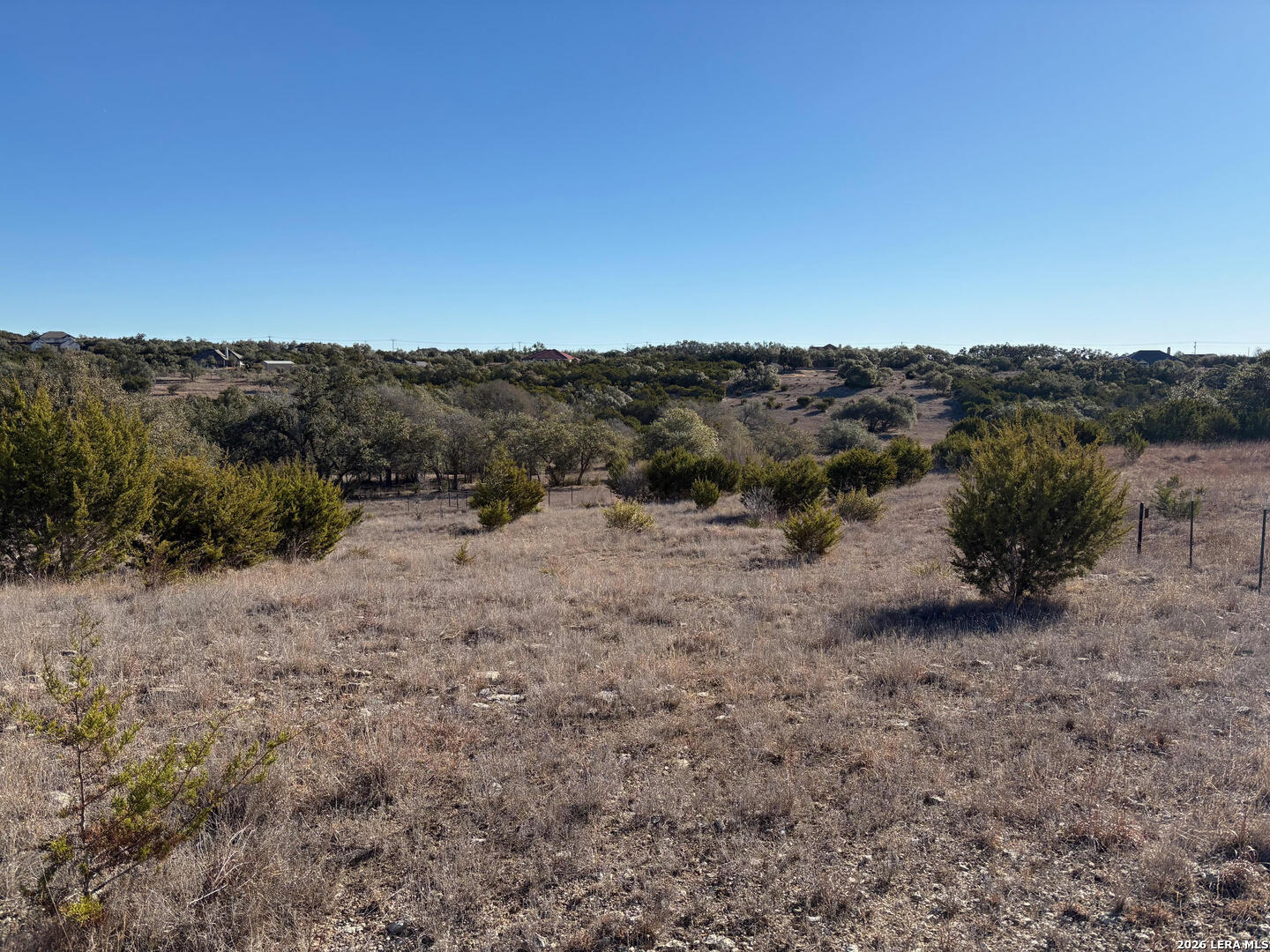 552-lot 2002) Rock Trail Spring Branch, TX 78070 - Photo 7 of 39 a view of a dry yard with mountains in the background