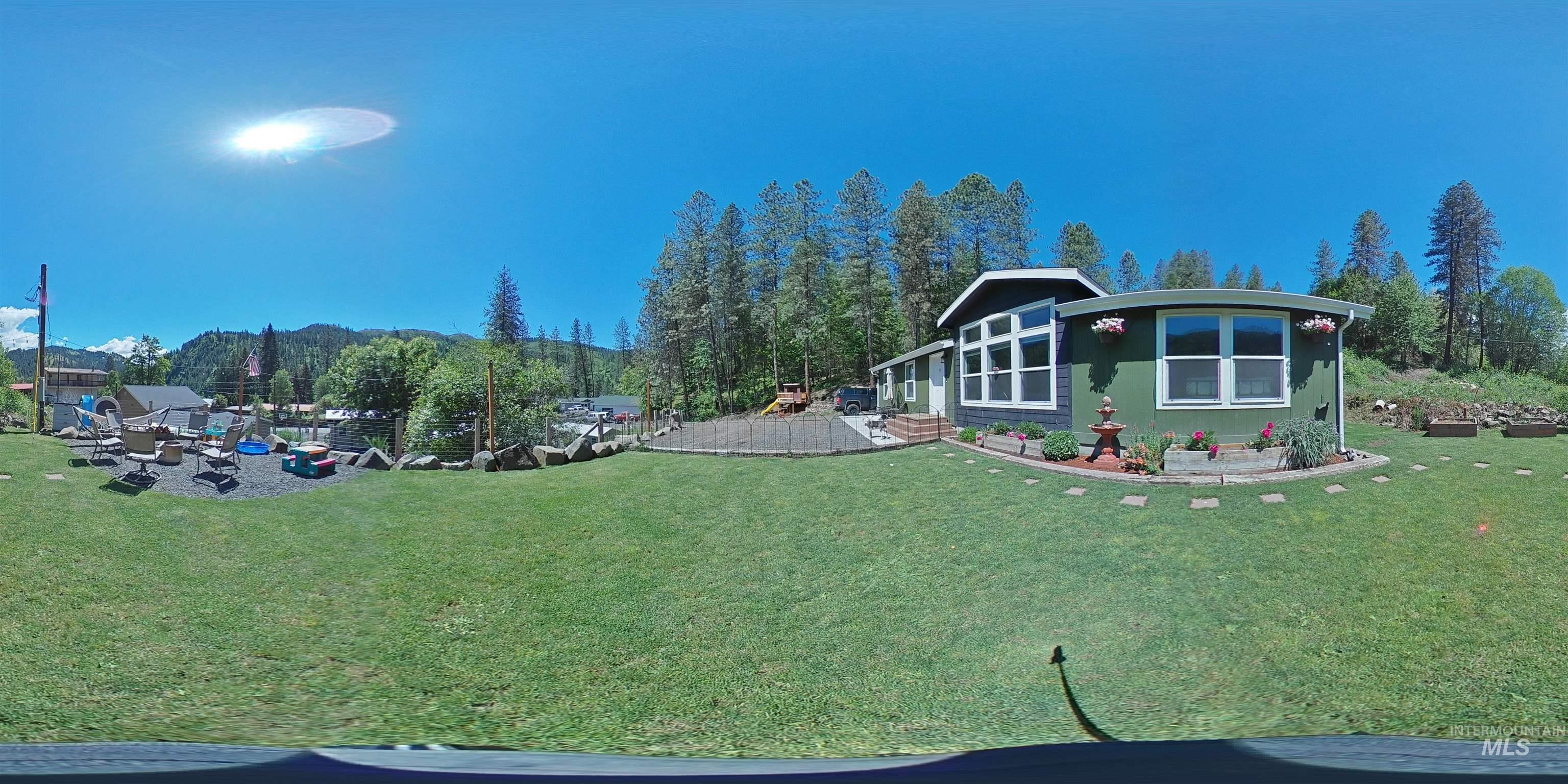 174 Konkolville Road Orofino, ID 83544 - Photo 36 of 43 Expansive green lawn with mountain backdrop
