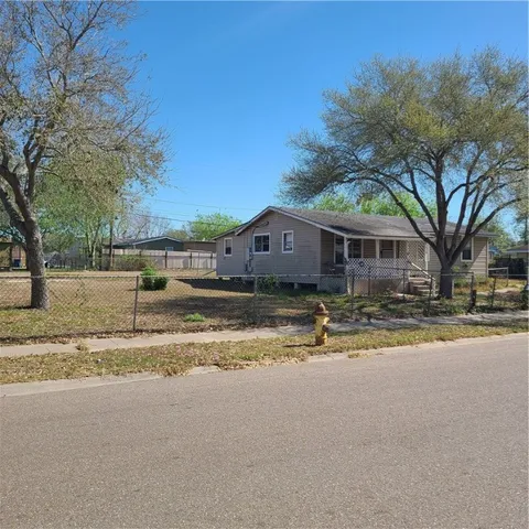 a view of house with snow on the road