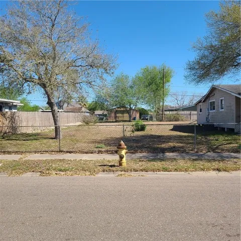 a backyard of house with trees