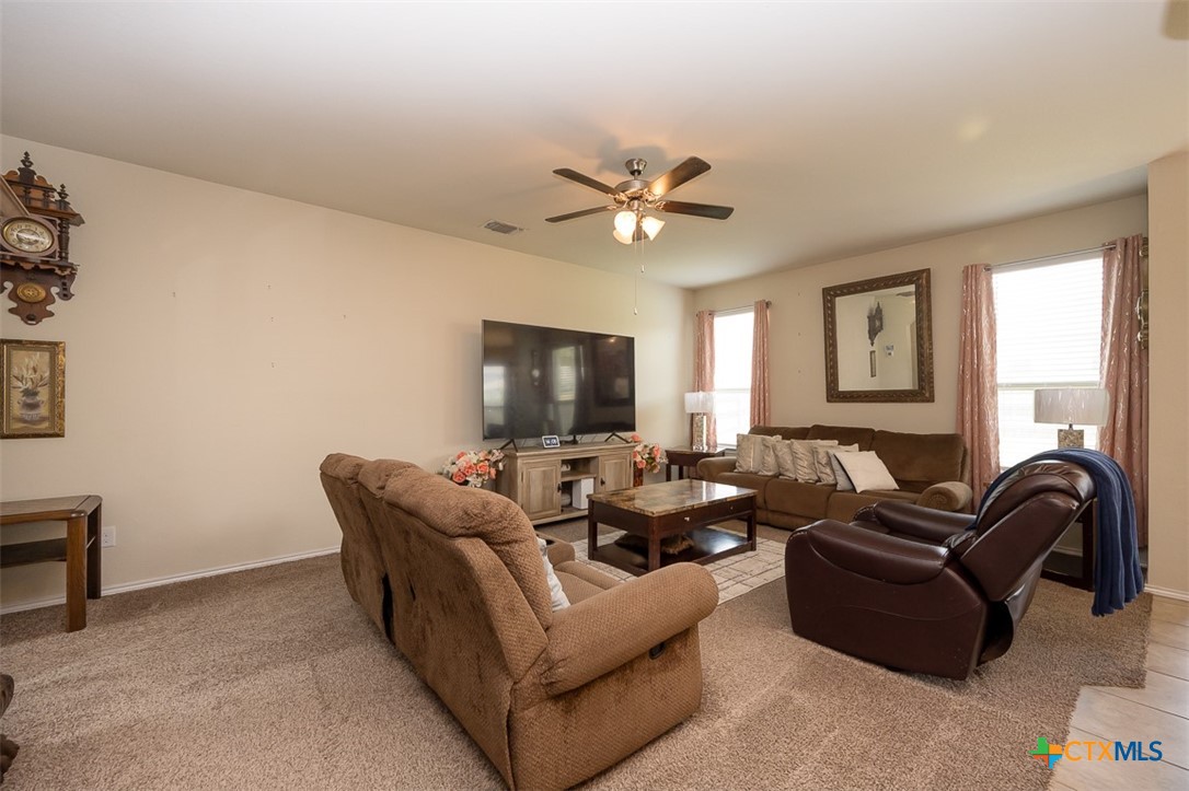 2511 Pintail Loop Copperas Cove, TX 76522 - Photo 4 of 26 a living room with furniture ceiling fan and a window