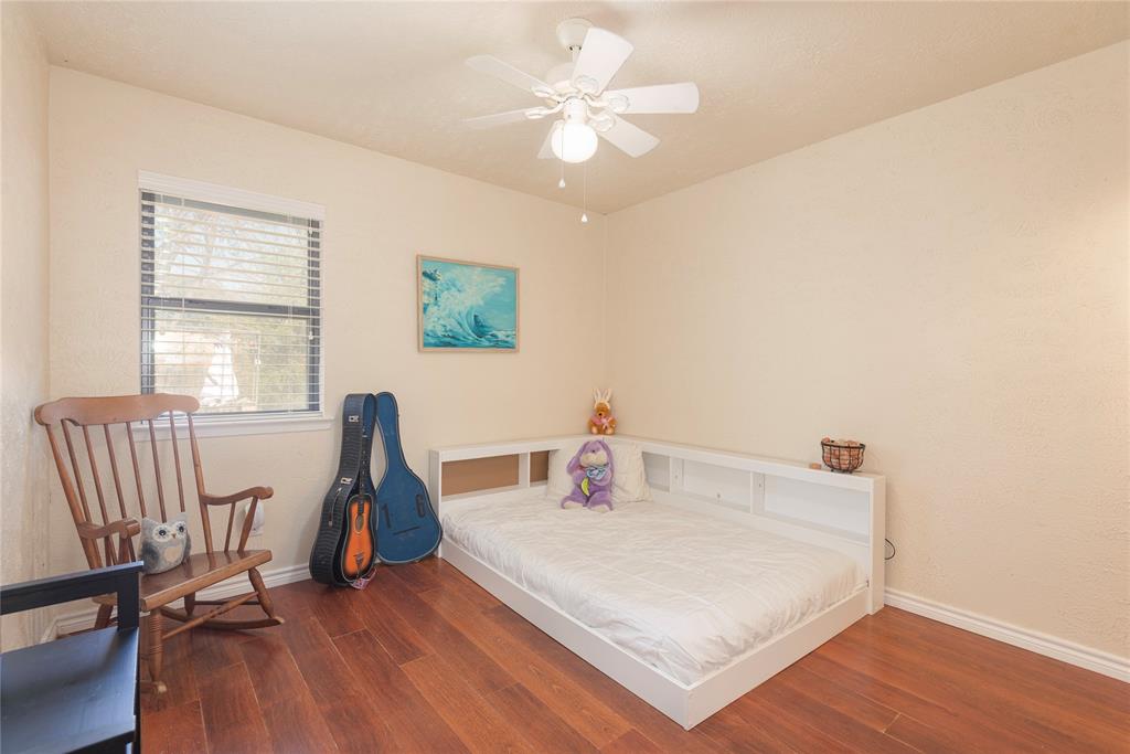 2005 Inverness Drive Carrollton, TX 75007 - Photo 19 of 25 a view of a workspace with furniture and a window