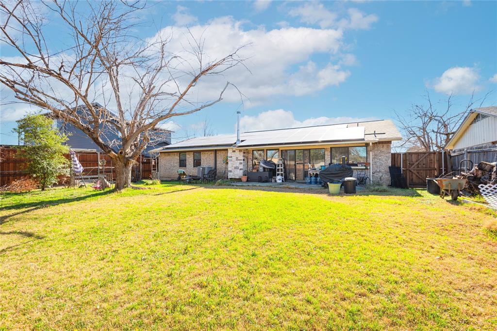 2005 Inverness Drive Carrollton, TX 75007 - Photo 4 of 25 a swimming pool with trees in front of it