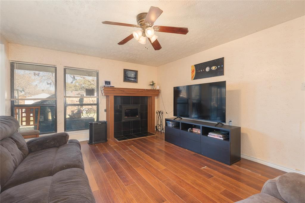 2005 Inverness Drive Carrollton, TX 75007 - Photo 8 of 25 a living room with furniture and a flat screen tv