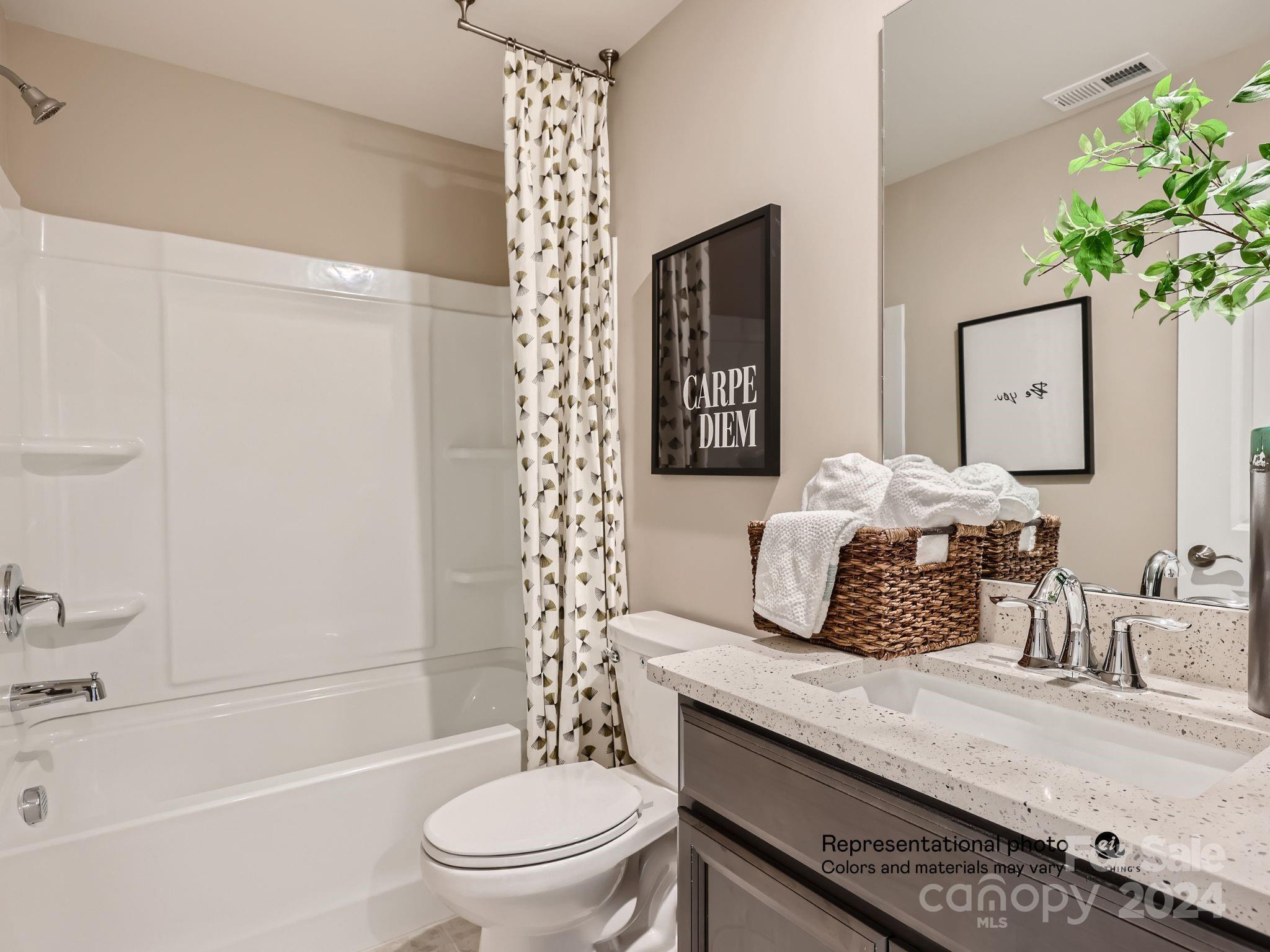 4468 Doyle Rdg Road Maiden, NC 28650 - Photo 12 of 16 a bathroom with a granite countertop sink a toilet a mirror a vanity and shower
