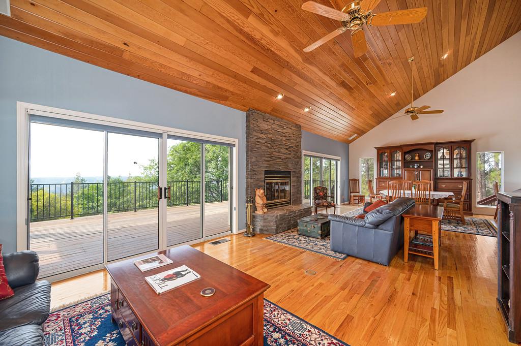 2358 Deer Ravine Court Cool, CA 95614 - Photo 14 of 63 living area featuring light wood finished floors, a fireplace, ceiling fan, a vaulted wood ceiling, and recessed lighting with a beautiful view