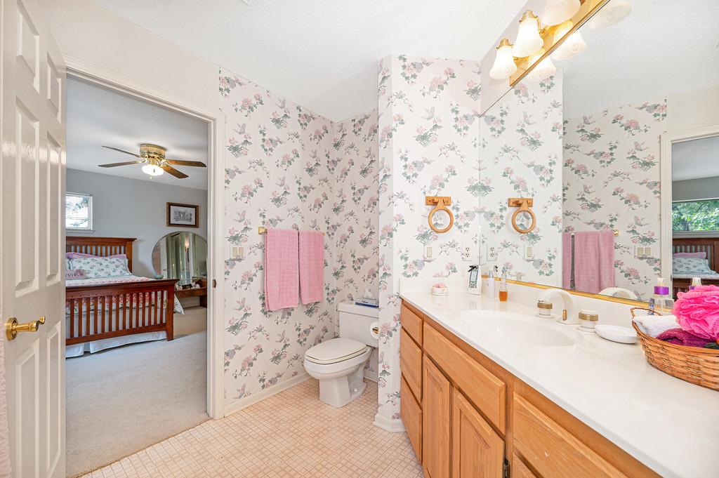 2358 Deer Ravine Court Cool, CA 95614 - Photo 25 of 63 a spacious bathroom with a sink mirror vanity and toilet