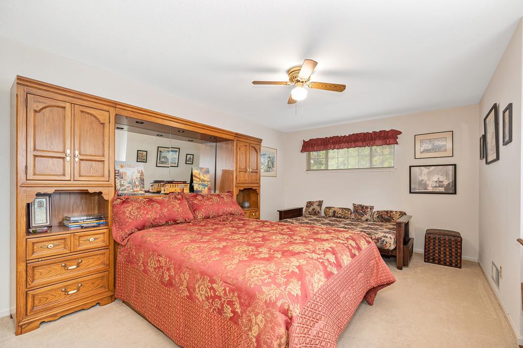 2358 Deer Ravine Court Cool, CA 95614 - Photo 26 of 63 upstairs bedroom with ceiling fan and light carpet