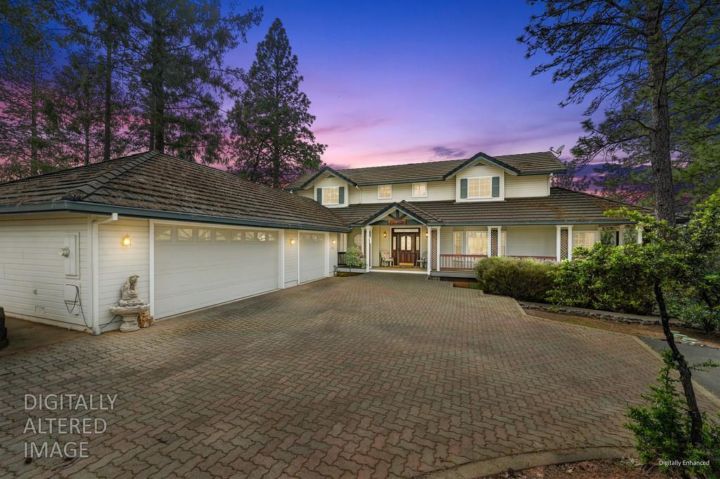 2358 Deer Ravine Court Cool, CA 95614 - Photo 3 of 63 view of front of property with covered porch, a garage, and decorative driveway
