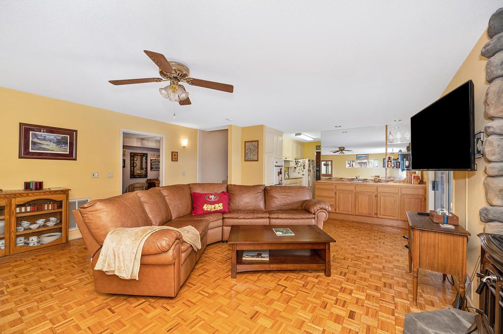 2358 Deer Ravine Court Cool, CA 95614 - Photo 34 of 63 living area featuring a ceiling fan and parquet flooring