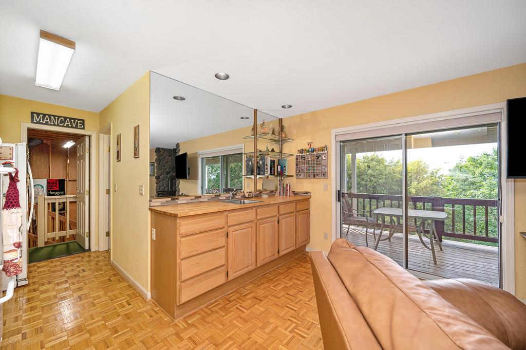 2358 Deer Ravine Court Cool, CA 95614 - Photo 62 of 63 Additional kitchen with light wood finish cabinets, parquet flooring, open floor plan, butcher block countertops, and freestanding refrigerator