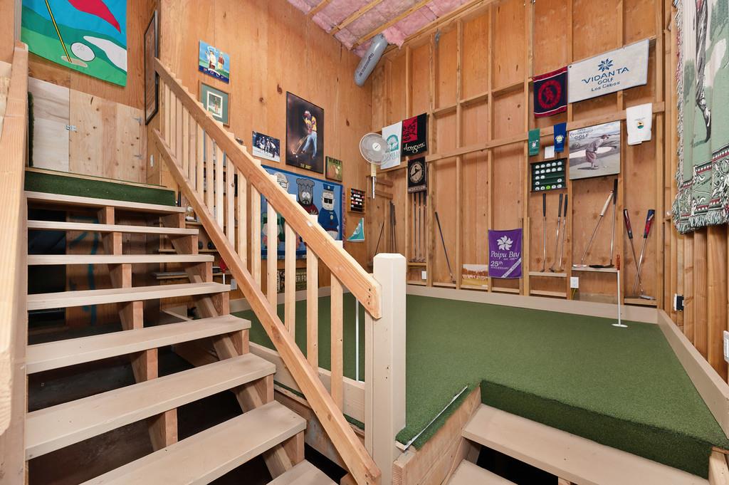 2358 Deer Ravine Court Cool, CA 95614 - Photo 39 of 63 stairway with wood walls and your own personal putting green