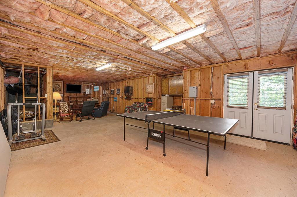 2358 Deer Ravine Court Cool, CA 95614 - Photo 41 of 63 bonus/storage room featuring concrete floors, wood walls, and french doors