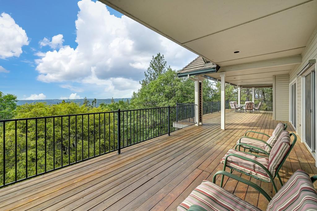 2358 Deer Ravine Court Cool, CA 95614 - Photo 47 of 63 a view of a balcony with wooden floor