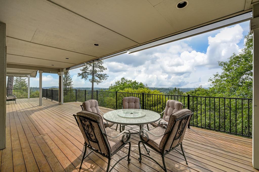 2358 Deer Ravine Court Cool, CA 95614 - Photo 49 of 63 wooden deck with outdoor dining area