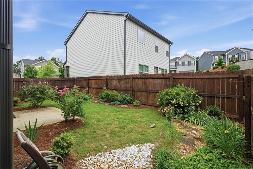 585 Summit Point Canton, GA 30114 - Photo 28 of 30 a view of a house with a yard and plants