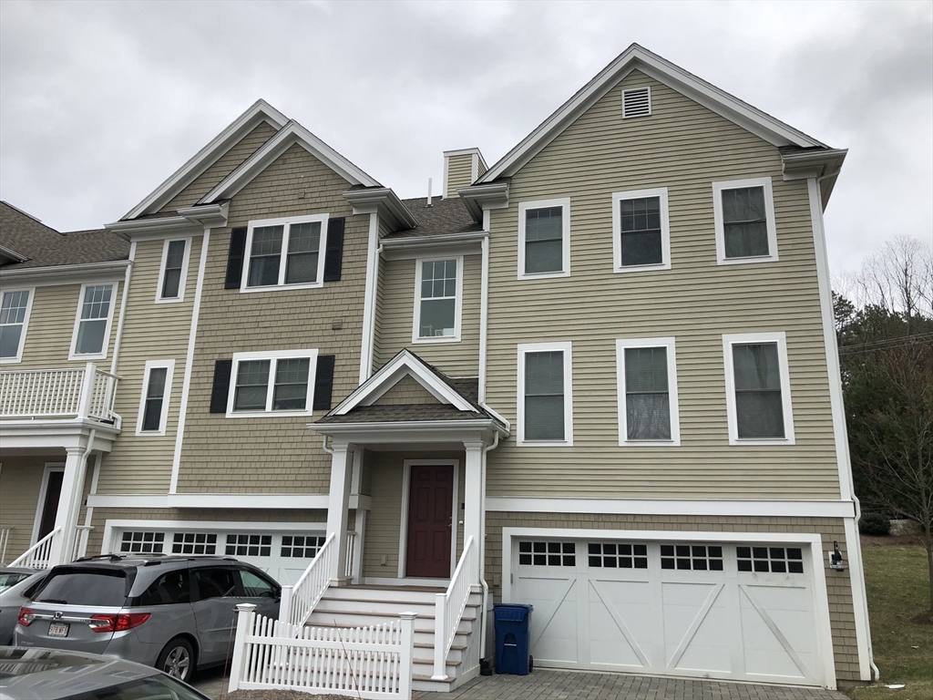 4 Reserve Way, Unit D Burlington, MA 01803 - Photo 1 of 17 a front view of a house with a yard