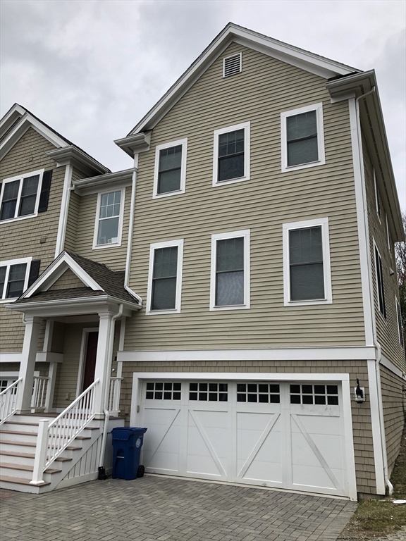 4 Reserve Way, Unit D Burlington, MA 01803 - Photo 14 of 17 a front view of a house with a garage