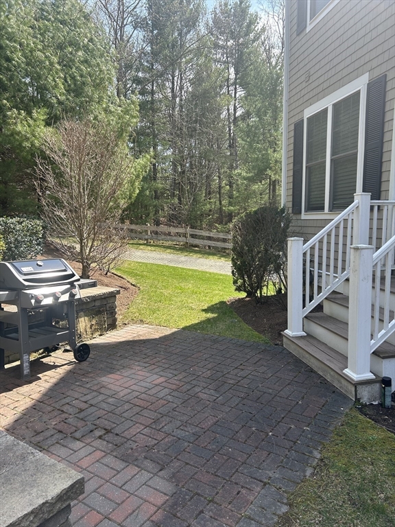 4 Reserve Way, Unit D Burlington, MA 01803 - Photo 16 of 17 a view of a house with backyard and swimming pool