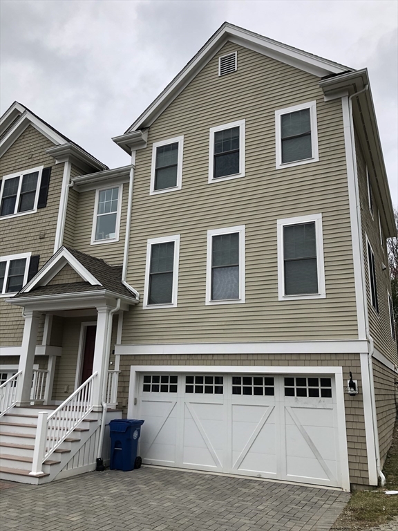 4 Reserve Way, Unit D Burlington, MA 01803 - Photo 3 of 17 a front view of a house with a garage