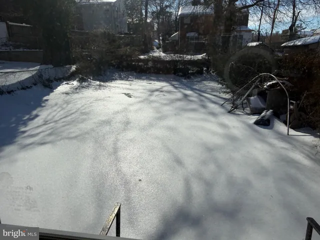 a backyard of a house with yard and outdoor seating