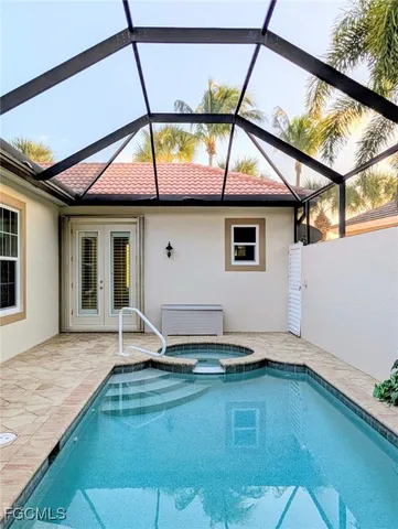 a house view with swimming pool