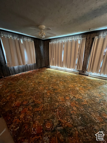108 South Road Montpelier, ID 83254 - Photo 16 of 36 View of yard with baseboard heating and a ceiling fan