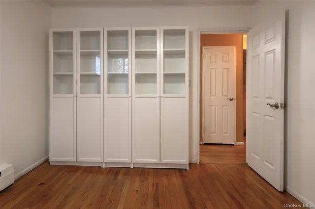 wooden floor with white walls