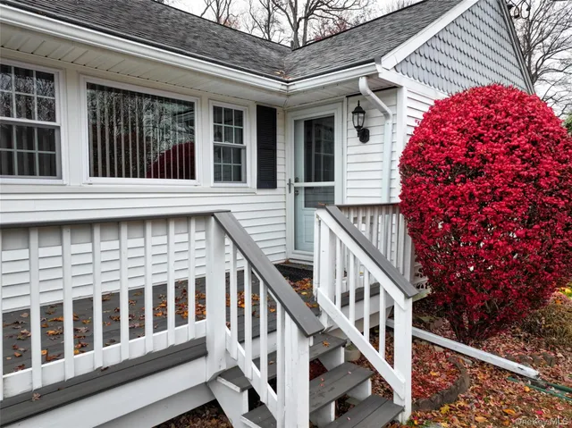 a view of a house with staircase and deck