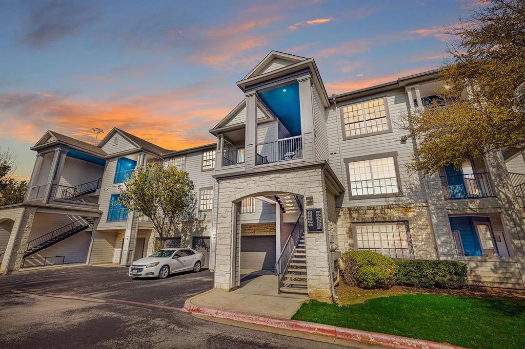 10505 I-35 Frontage Road South, Unit 118 Austin, TX 78747 - Photo 2 of 24 a front view of a house with garden