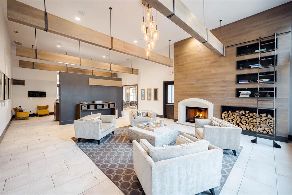 10505 I-35 Frontage Road South, Unit 118 Austin, TX 78747 - Photo 21 of 24 a living room with furniture and a fireplace