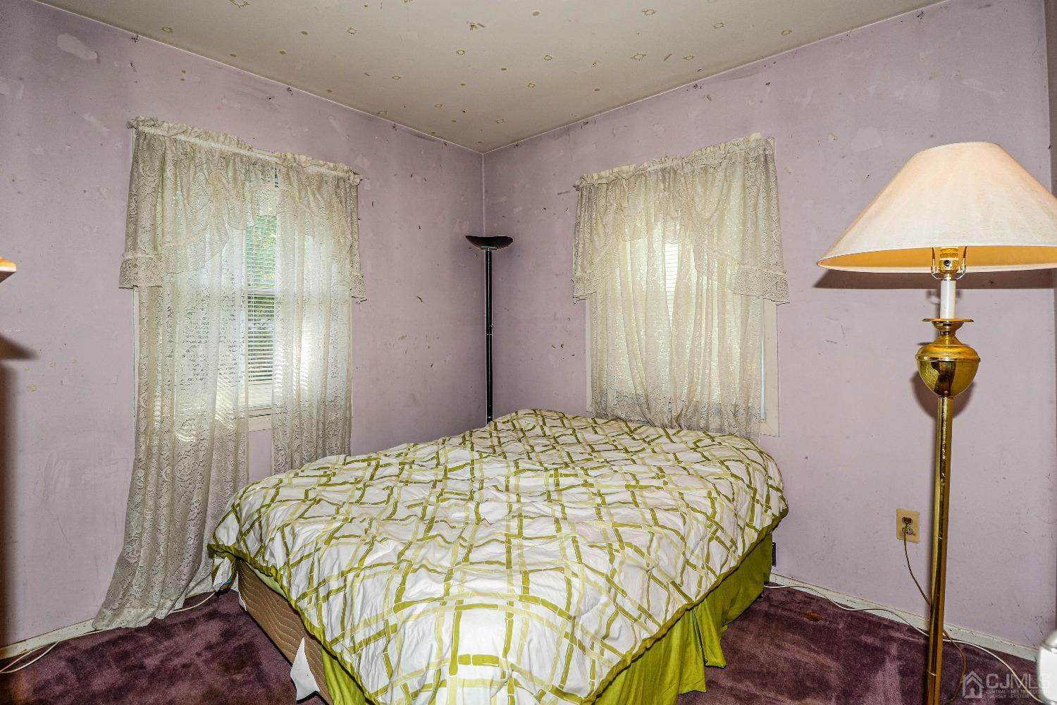 36 Gurley Road Edison, NJ 08817 - Photo 15 of 19 a bedroom with a bed and a chandelier