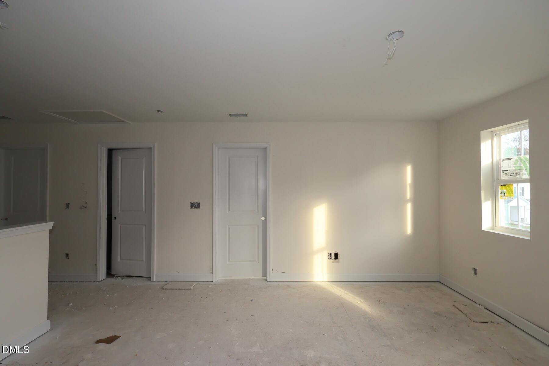 1321 Dimaggio Drive Raleigh, NC 27616 - Photo 12 of 28 an empty room with windows and closet