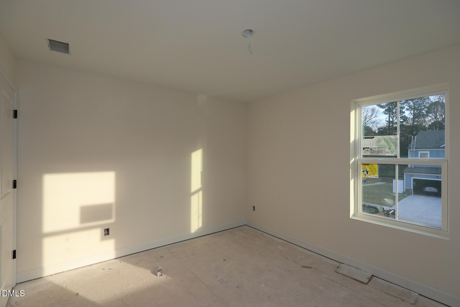 1321 Dimaggio Drive Raleigh, NC 27616 - Photo 16 of 28 an empty room with windows