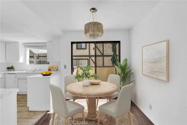 a view of a dining room with furniture and window