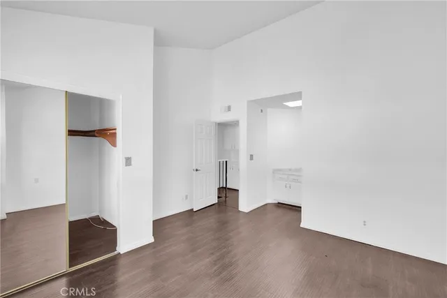 an empty room with wooden floor