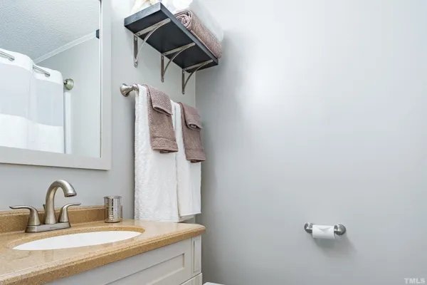 a bathroom with a shower and a sink