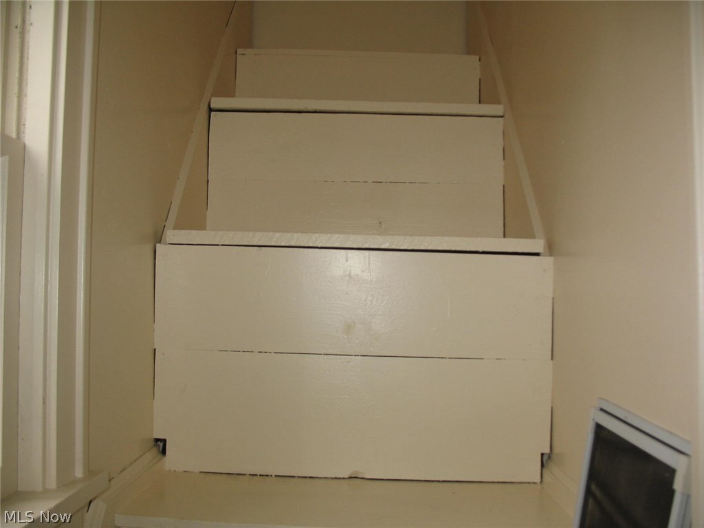 14537 Alger Road Cleveland, OH 44111 - Photo 9 of 14 In master closet access to attic: stairs have storage.