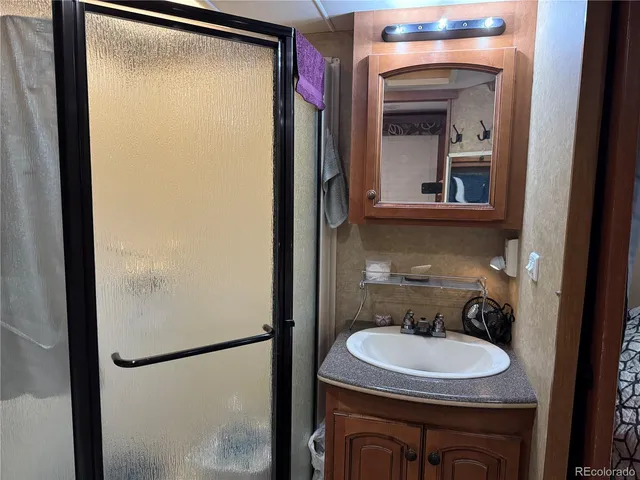 a bathroom with a sink and a mirror