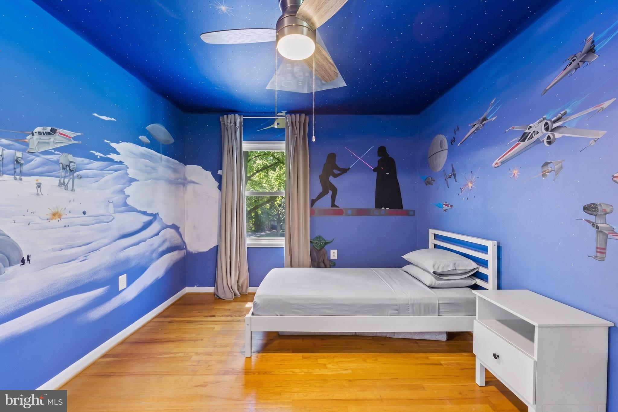 11019 Ring Road Reston, VA 20190 - Photo 46 of 78 a bedroom with a bed and a chandelier